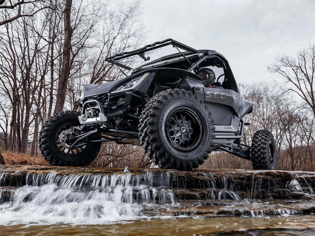 Standard XT Warrior Tires 32x10x15 on 15x7 Assault Industries Hellfire Matte Titanium Wheels 4/136 Pattern